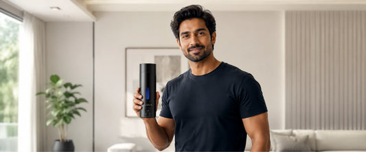 Happy man holding H2QUA Hydrogen water bottle